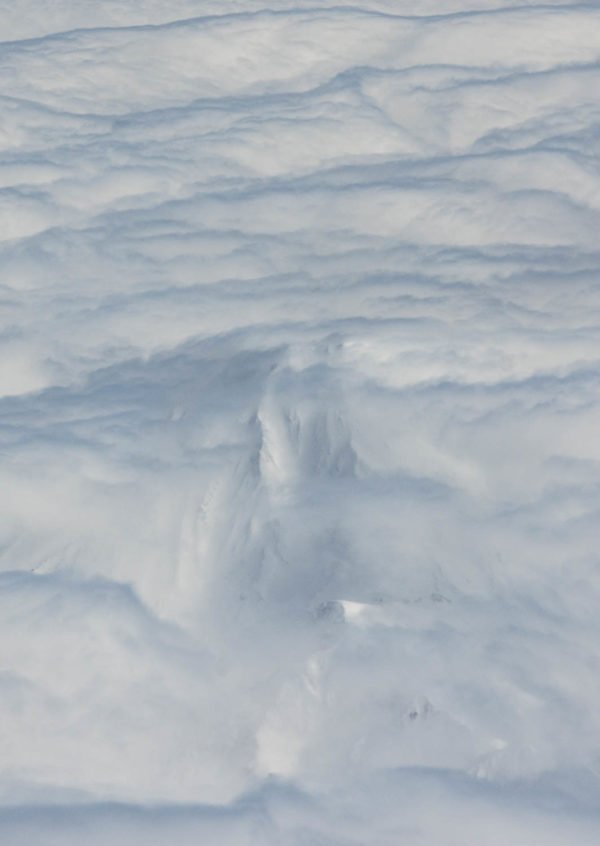 Hide-and-seek. Flying over Bakening volcano, Ganalsky range, Kamchatka.